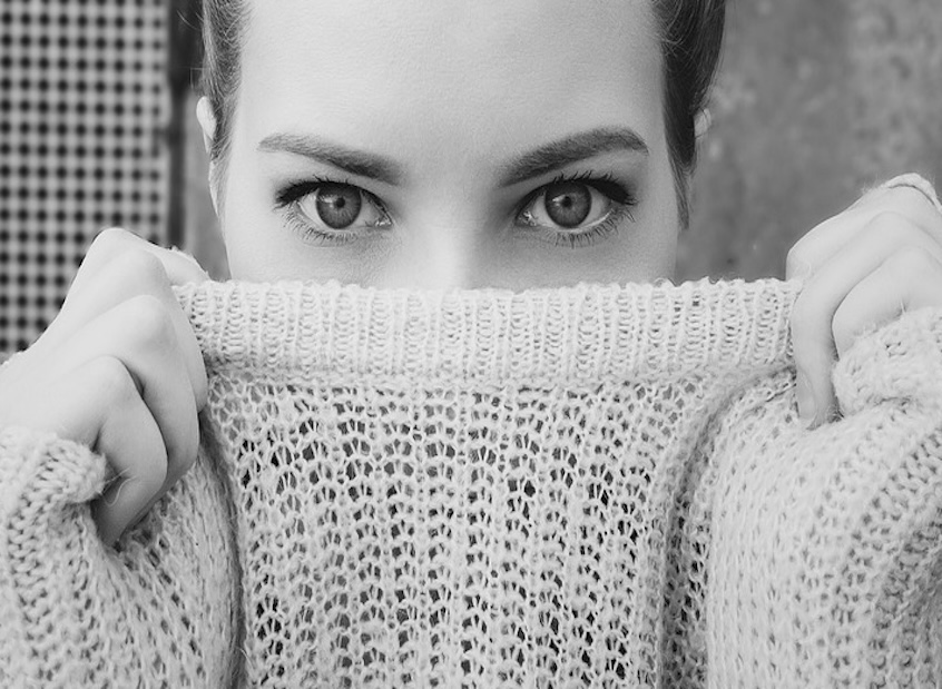 Image of a female hiding her face